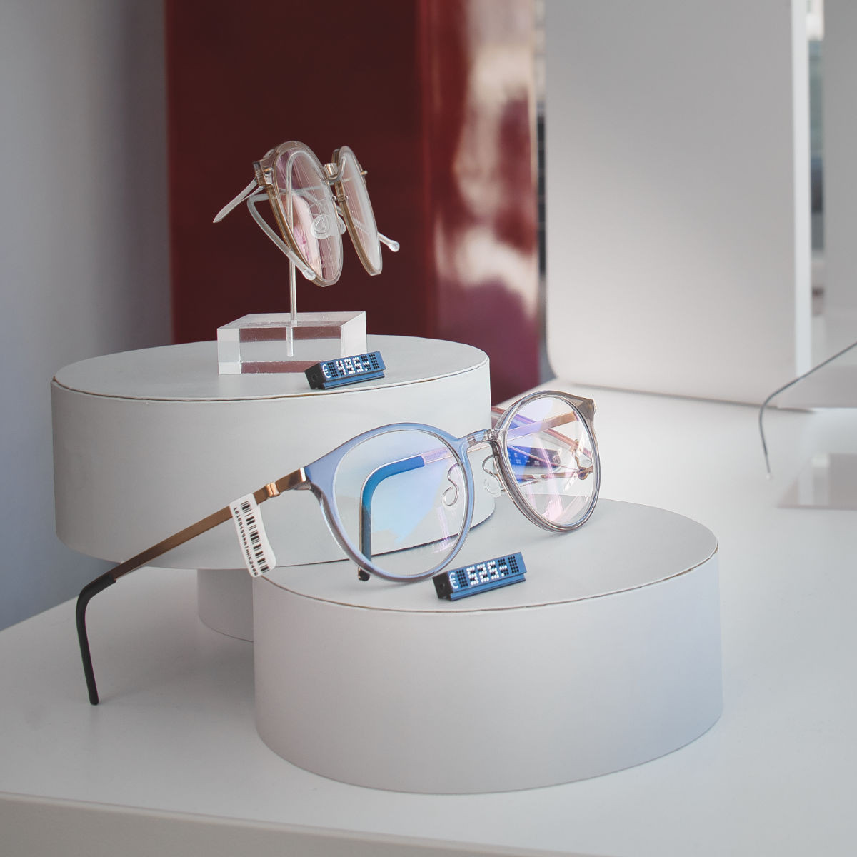 Exclusive LINDBERG frames in the shop window in Mittersill - elegant design with blurred background of other models.