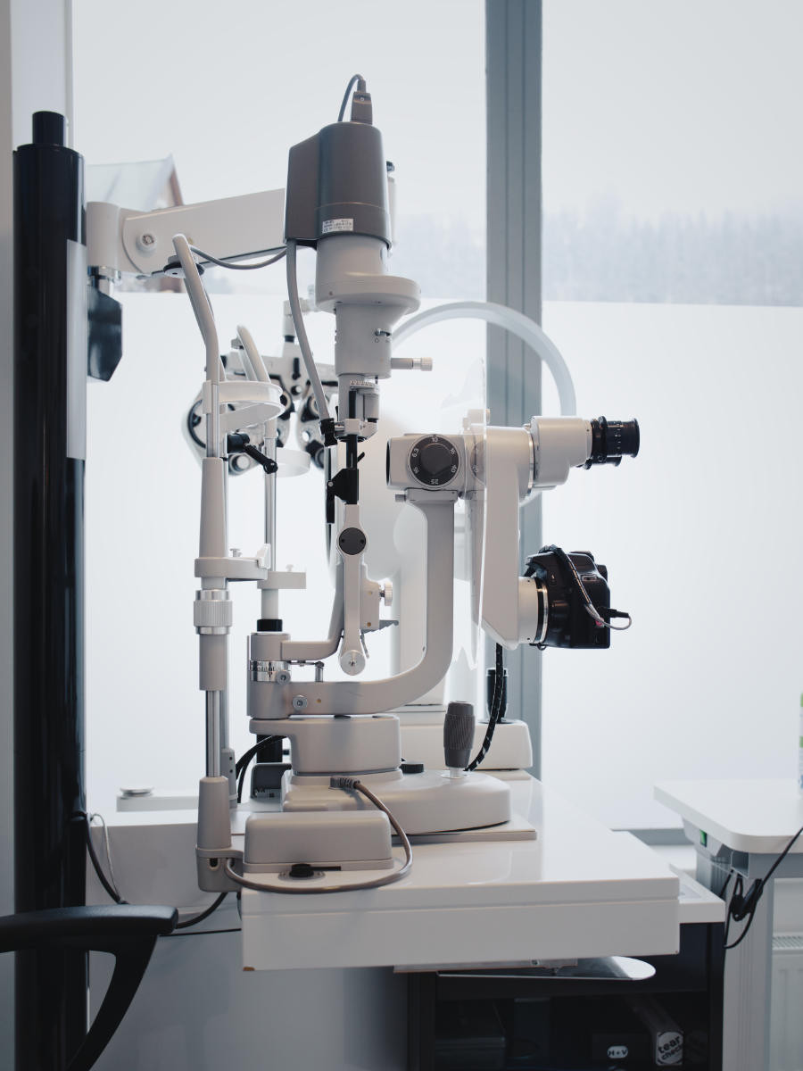 Side view of a modern optometric instrument.